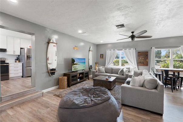 Dining room, Interior, Kitchen, Living room, Recessed Lighting, Stainless Steel Appliances, Wood Texture Flooring