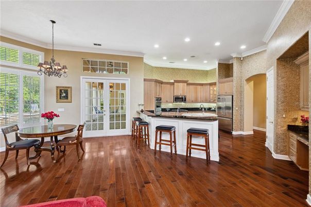 Chandelier, Dining room, Interior, Kitchen, Recessed Lighting, Stainless Steel Appliances, Wood Texture Flooring