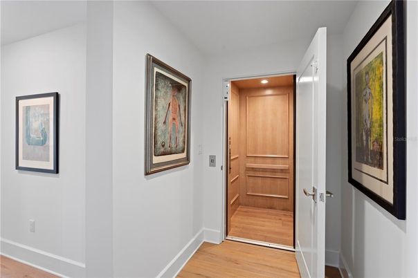 Elevator, Interior, Recessed Lighting, Wood Texture Flooring, Wooden Walls