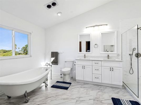 Bathroom, Dual Sink Vanities, Free Standing Baths, Glass Shower, Interior, Marble, Marble Walls, Recessed Lighting