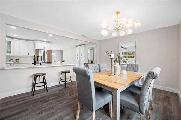 Dining room, Interior, Kitchen, Pendant Lights, Recessed Lighting, Stainless Steel Appliances, Wood Texture Flooring