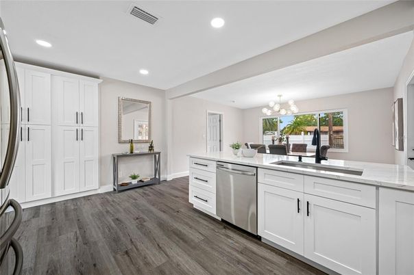Dining room, Interior, Kitchen, Recessed Lighting, Stainless Steel Appliances, Wood Texture Flooring