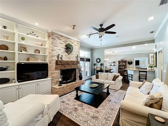 Dining room, Fireplace, Interior, Living room, Recessed Lighting, Stone Walls, Wood Texture Flooring