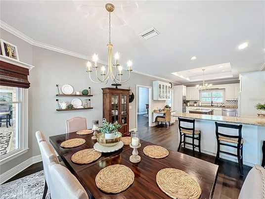 Chandelier, Dining room, Interior, Kitchen, Recessed Lighting, Stainless Steel Appliances, Wood Texture Flooring
