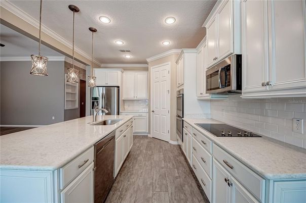 Interior, Kitchen, Pendant Lights, Recessed Lighting, Stainless Steel Appliances, Wood Texture Flooring