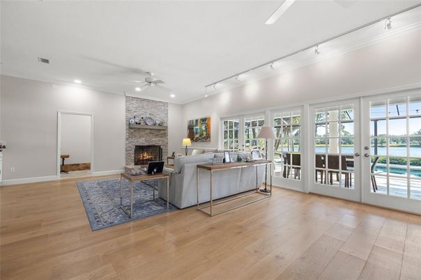 Fireplace, Interior, Living room, Recessed Lighting, Stone Walls, Wood Texture Flooring