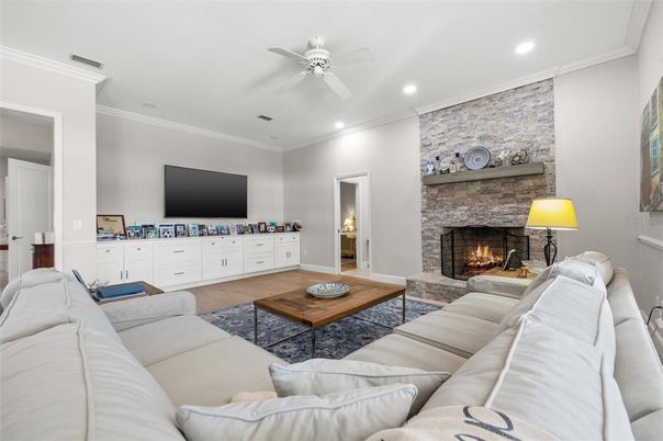 Fireplace, Interior, Living room, Recessed Lighting, Stone Walls, Wood Texture Flooring