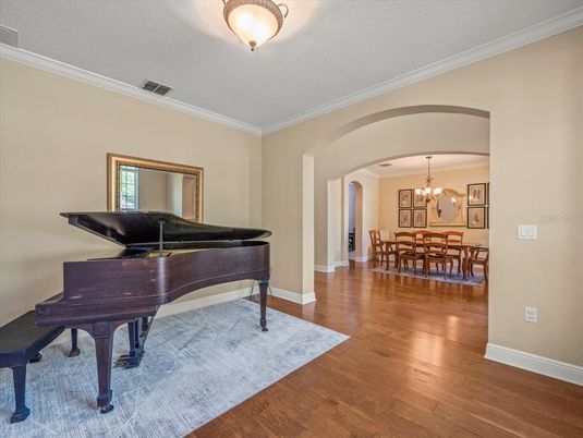 Chandelier, Dining room, Interior, Piano, Wood Texture Flooring
