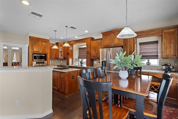 Dining room, Interior, Kitchen, Pendant Lights, Recessed Lighting, Stainless Steel Appliances, Wood Texture Flooring