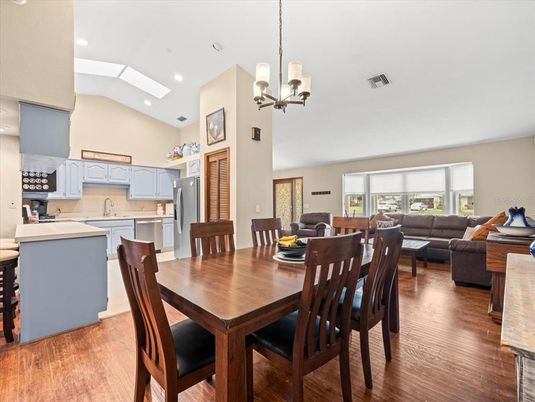 Dining room, Interior, Kitchen, Living room, Pendant Lights, Recessed Lighting, Stainless Steel Appliances, Wood Texture Flooring