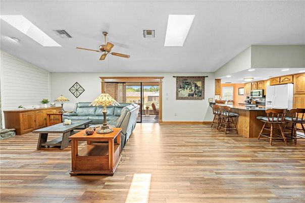 Dining room, Interior, Kitchen, Living room, Recessed Lighting, Stainless Steel Appliances, Wood Texture Flooring