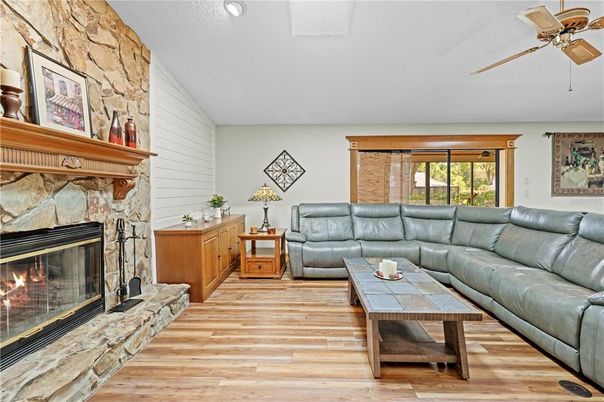 Fireplace, Interior, Living room, Recessed Lighting, Stone Walls, Wood Texture Flooring
