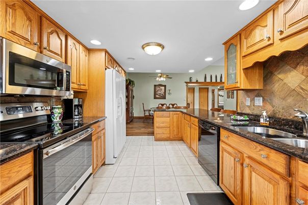 Dining room, Interior, Kitchen, Recessed Lighting, Stainless Steel Appliances, Wood Texture Flooring
