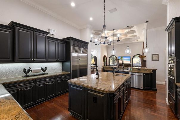 Chandelier, Interior, Kitchen, Pendant Lights, Recessed Lighting, Stainless Steel Appliances, Wood Texture Flooring