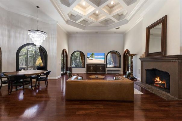 Chandelier, Dining room, Fireplace, Interior, Living room, Recessed Lighting, Wood Texture Flooring