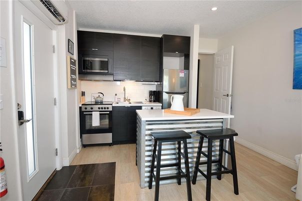 Interior, Kitchen, Recessed Lighting, Stainless Steel Appliances, Wood Texture Flooring