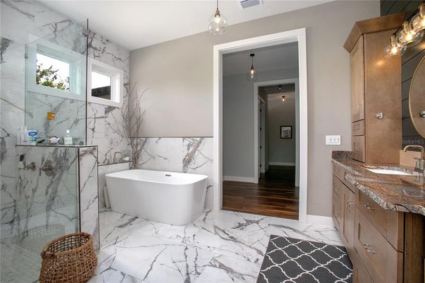 Bathroom, Free Standing Baths, Glass Shower, Interior, Marble, Marble Walls, Pendant Lights, Wood Texture Flooring