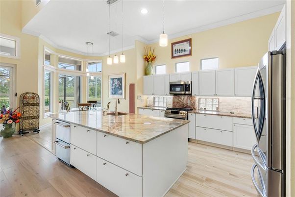 Dining room, Interior, Kitchen, Pendant Lights, Recessed Lighting, Stainless Steel Appliances, Wood Texture Flooring