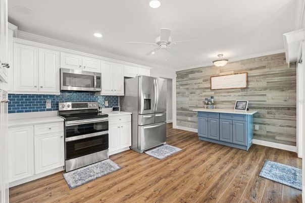 Interior, Kitchen, Recessed Lighting, Stainless Steel Appliances, Wood Texture Flooring, Wooden Walls