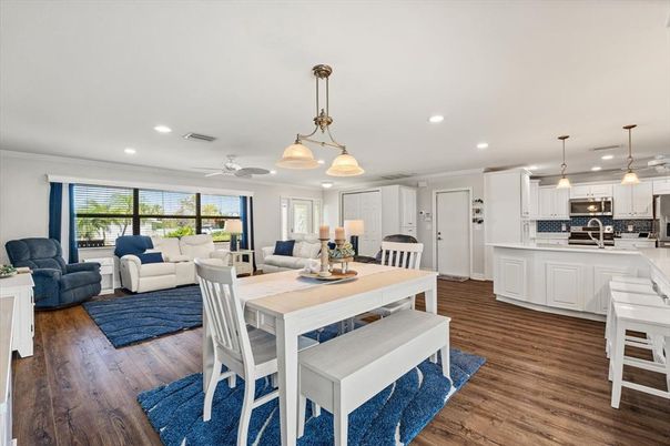 Dining room, Interior, Kitchen, Living room, Pendant Lights, Recessed Lighting, Stainless Steel Appliances, Wood Texture Flooring