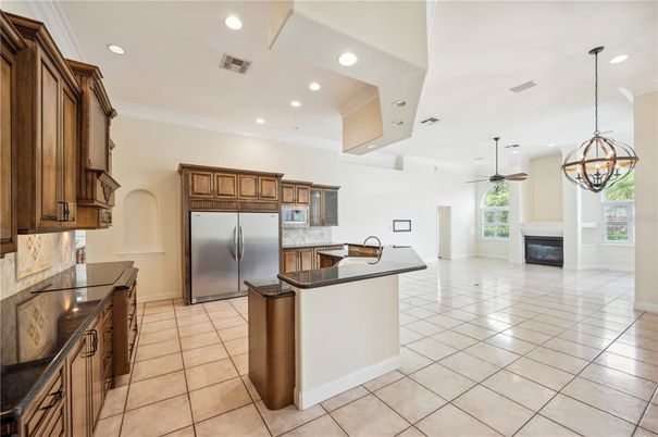Chandelier, Fireplace, Interior, Kitchen, Pendant Lights, Recessed Lighting, Stainless Steel Appliances
