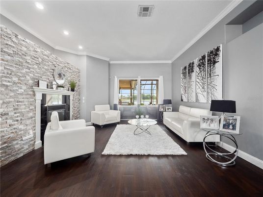 Fireplace, Interior, Living room, Recessed Lighting, Stone Walls, Wood Texture Flooring