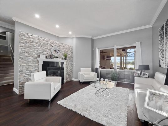 Fireplace, Interior, Living room, Recessed Lighting, Stone Walls, Wood Texture Flooring