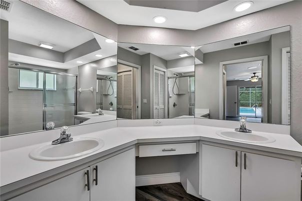 Bathroom, Dual Sink Vanities, Glass Shower, Interior, Recessed Lighting, Wood Texture Flooring