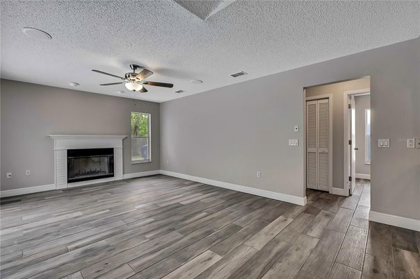 Empty room, Fireplace, Interior, Recessed Lighting, Wood Texture Flooring