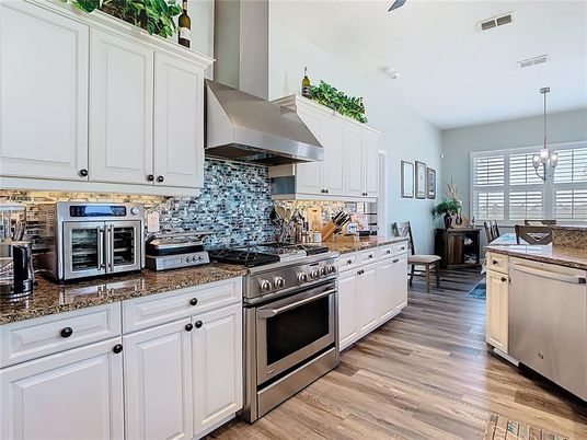 Dining room, Interior, Kitchen, Pendant Lights, Stainless Steel Appliances, Wood Texture Flooring