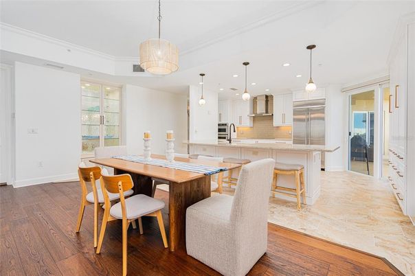 Dining room, Interior, Kitchen, Pendant Lights, Recessed Lighting, Stainless Steel Appliances, Wood Texture Flooring