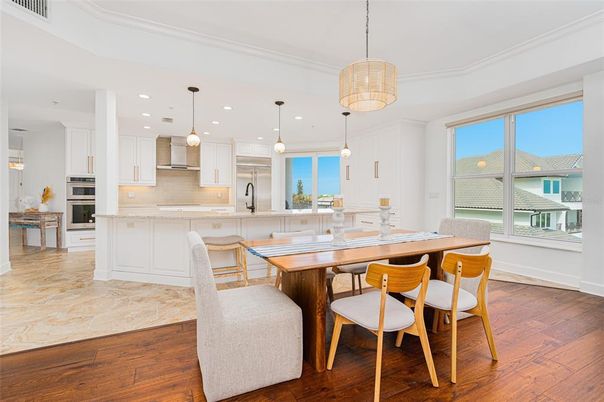 Dining room, Interior, Kitchen, Pendant Lights, Recessed Lighting, Stainless Steel Appliances, Wood Texture Flooring
