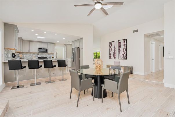 Dining room, Interior, Kitchen, Recessed Lighting, Stainless Steel Appliances, Wood Texture Flooring