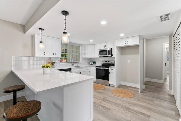 Interior, Kitchen, Pendant Lights, Recessed Lighting, Stainless Steel Appliances, Wood Texture Flooring