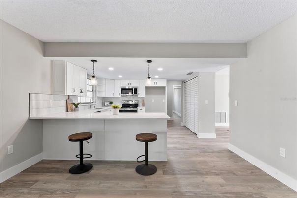 Interior, Kitchen, Pendant Lights, Recessed Lighting, Stainless Steel Appliances, Wood Texture Flooring