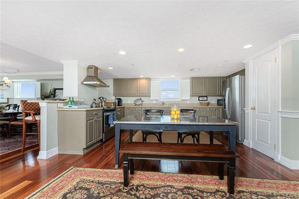Chandelier, Dining room, Interior, Kitchen, Recessed Lighting, Stainless Steel Appliances, Wood Texture Flooring