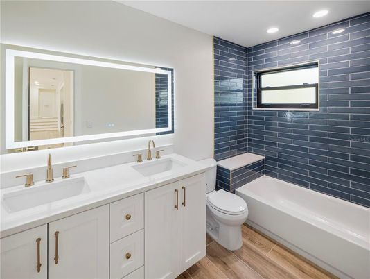 Bathroom, Dual Sink Vanities, Interior, Recessed Lighting, Wood Texture Flooring