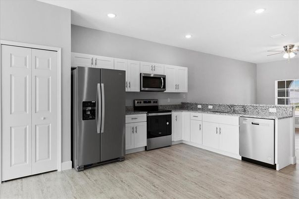 Interior, Kitchen, Recessed Lighting, Stainless Steel Appliances, Wood Texture Flooring