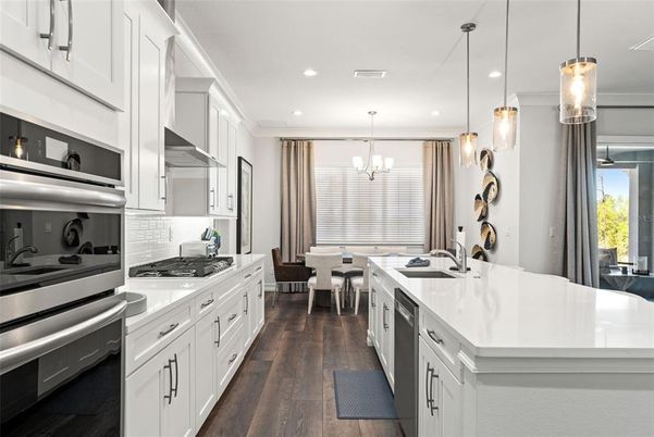 Chandelier, Dining room, Interior, Kitchen, Pendant Lights, Recessed Lighting, Stainless Steel Appliances, Wood Texture Flooring