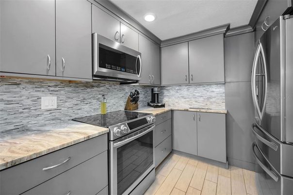 Interior, Kitchen, Recessed Lighting, Stainless Steel Appliances, Wood Texture Flooring