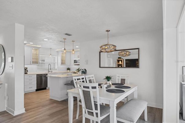 Dining room, Interior, Kitchen, Pendant Lights, Recessed Lighting, Stainless Steel Appliances, Wood Texture Flooring