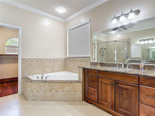 Bathroom, Dual Sink Vanities, Glass Shower, Interior, Recessed Lighting, Wood Texture Flooring