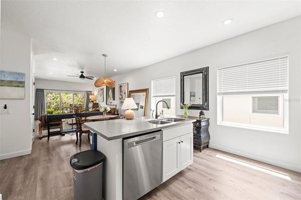 Dining room, Interior, Kitchen, Pendant Lights, Recessed Lighting, Stainless Steel Appliances, Wood Texture Flooring