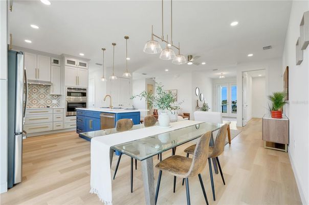 Dining room, Interior, Kitchen, Pendant Lights, Recessed Lighting, Stainless Steel Appliances, Wood Texture Flooring