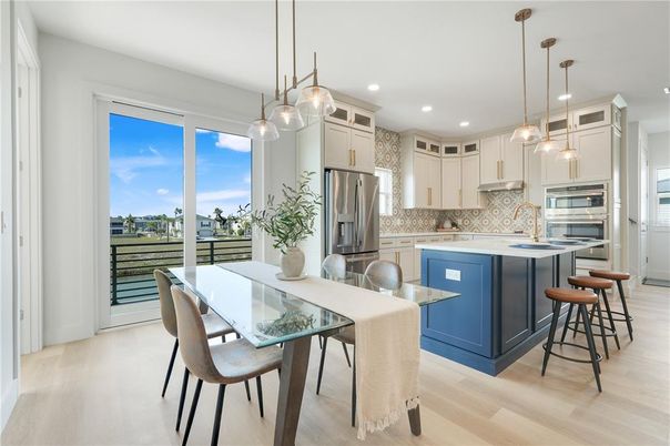 Dining room, Interior, Kitchen, Pendant Lights, Recessed Lighting, Stainless Steel Appliances, Wood Texture Flooring