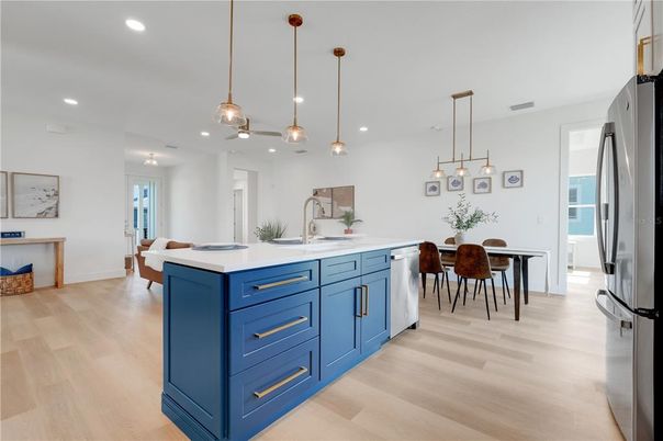 Dining room, Interior, Kitchen, Pendant Lights, Recessed Lighting, Stainless Steel Appliances, Wood Texture Flooring