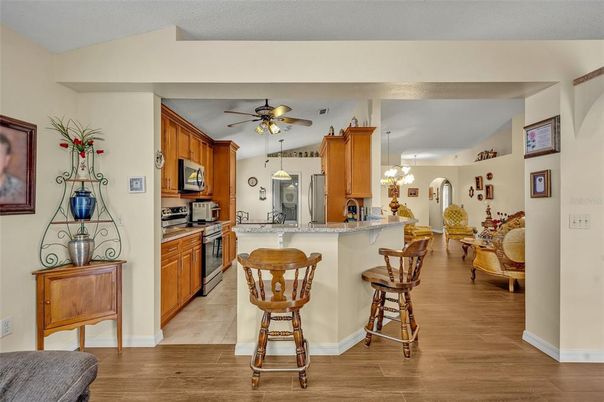 Dining room, Interior, Kitchen, Pendant Lights, Stainless Steel Appliances, Wood Texture Flooring