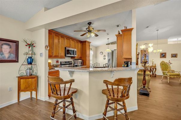 Dining room, Interior, Kitchen, Pendant Lights, Stainless Steel Appliances, Wood Texture Flooring