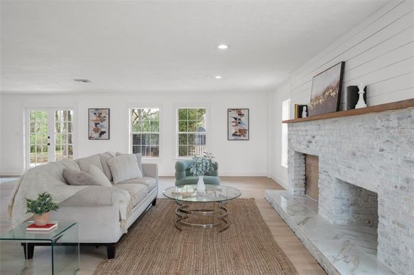 Fireplace, Interior, Living room, Recessed Lighting, Stone Walls, Wood Texture Flooring