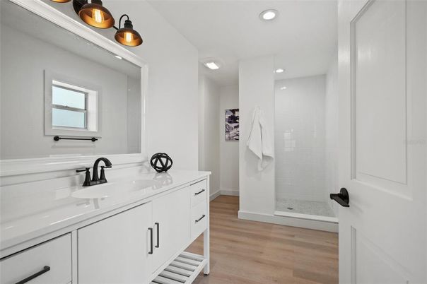 Bathroom, Dual Sink Vanities, Interior, Recessed Lighting, Wood Texture Flooring